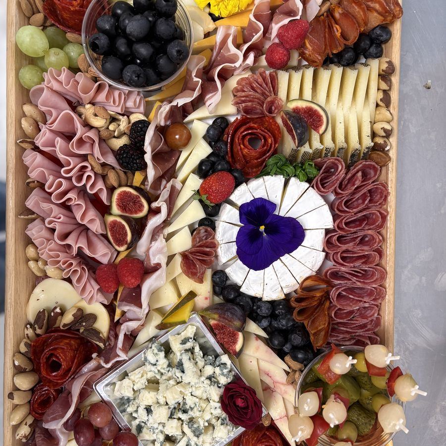 A charcuterie and cheese platter by Café Nomad.