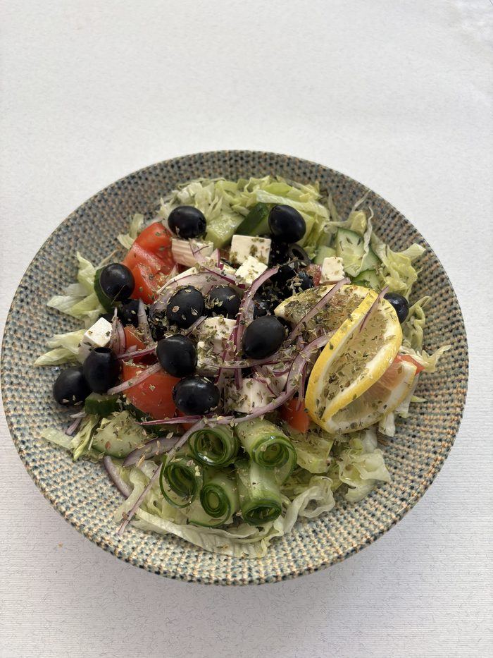 Greek salad with feta, olives and herbs.