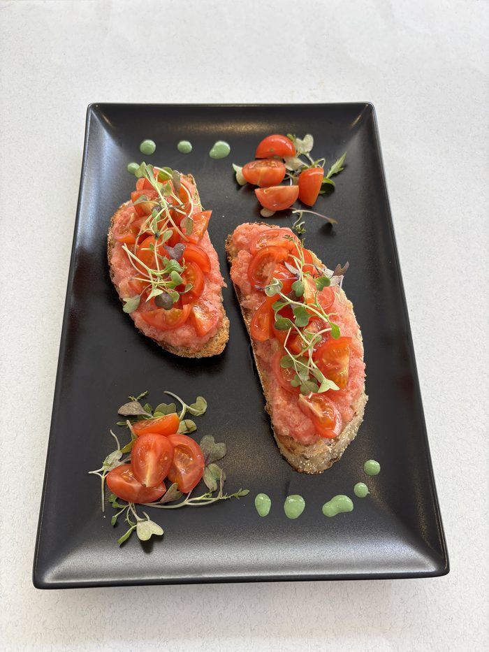 Smoked salmon on toast with cherry tomatoes.
